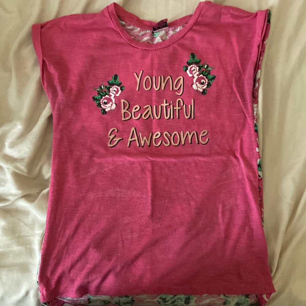 Selling to empty my closet. This is a pink medium shirt made by Aviva girls